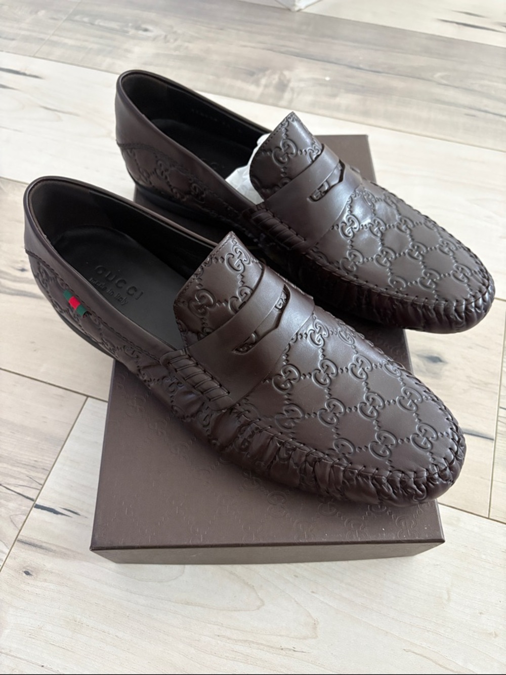 Gucci Men’s Brown Embossed Leather Penny Loafers